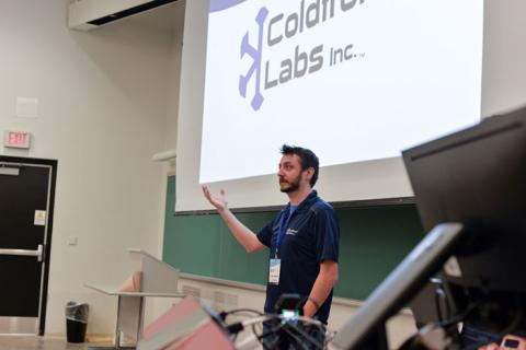 Developer speaker in front of board